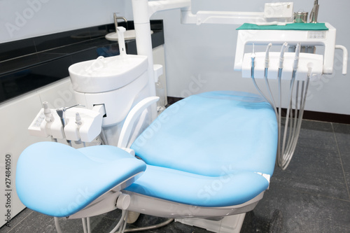 Dental chair and other accesries used by dentists in the office.