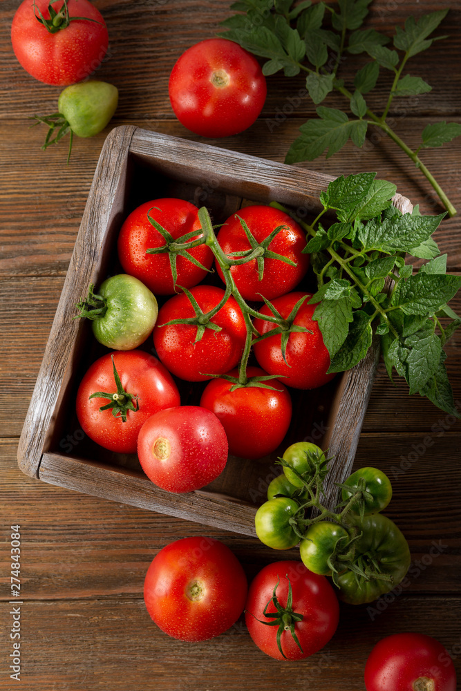 Fresh red tomatoes in wood crate Fresh red tomatoes in wood crate