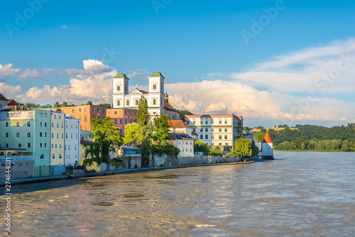 Embankment of Inn river with Church of St.Michael in Passau - Germany