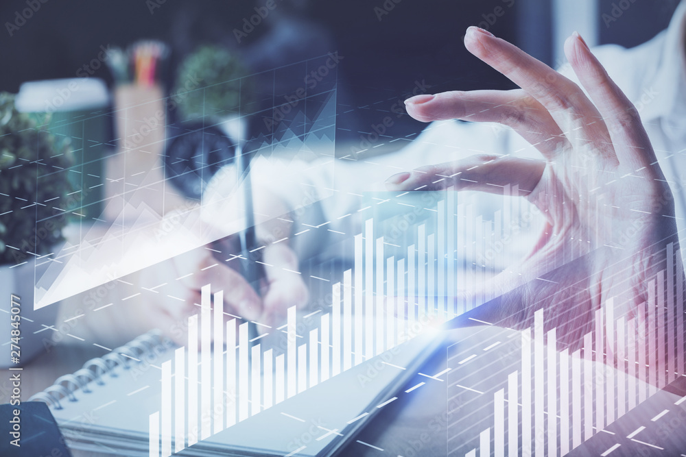 Forex chart displayed on woman's hand taking notes background. Concept of research. Multi exposure Forex chart displayed on woman's hand taking notes background. Concept of research. Multi exposure
