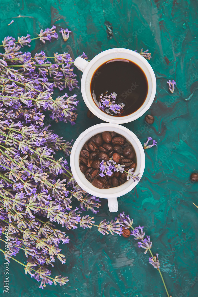Coffee, coffee grain in cups and lavender flower on green background - obrazy, fototapety, plakaty 