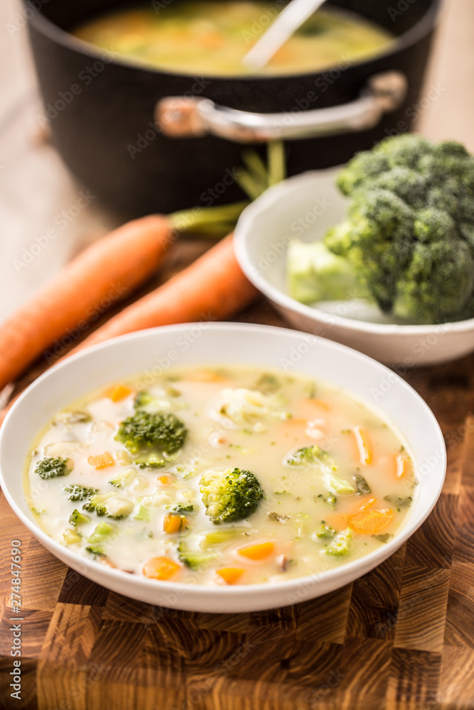 Vegetable soup from broccoli carrot onion and other ingredients. Healthy vegetarian food and meals Vegetable soup from broccoli carrot onion and other ingredients. Healthy vegetarian food and meals