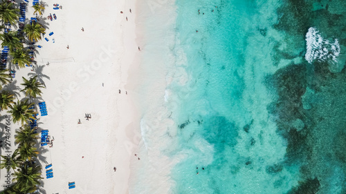 White sandy beach on a tropical island and clear sea. Top View of paradise beach. Beautiful sea view, shot by drones. Coral reef Aerial view.