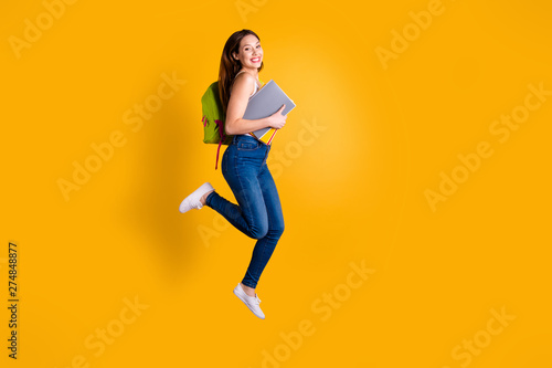 Fototapeta Naklejka Na Ścianę i Meble -  Full length body size view photo of cheerful lovely funny funky lady enjoy rejoice content dressed she her light-colored modern clothing sneakers isolated trendy white colorful yellow background
