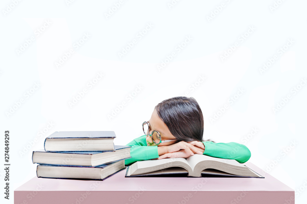 Asian cute girl with glasses fall asleep on book on the desk Asian cute girl with glasses fall asleep on book on the desk