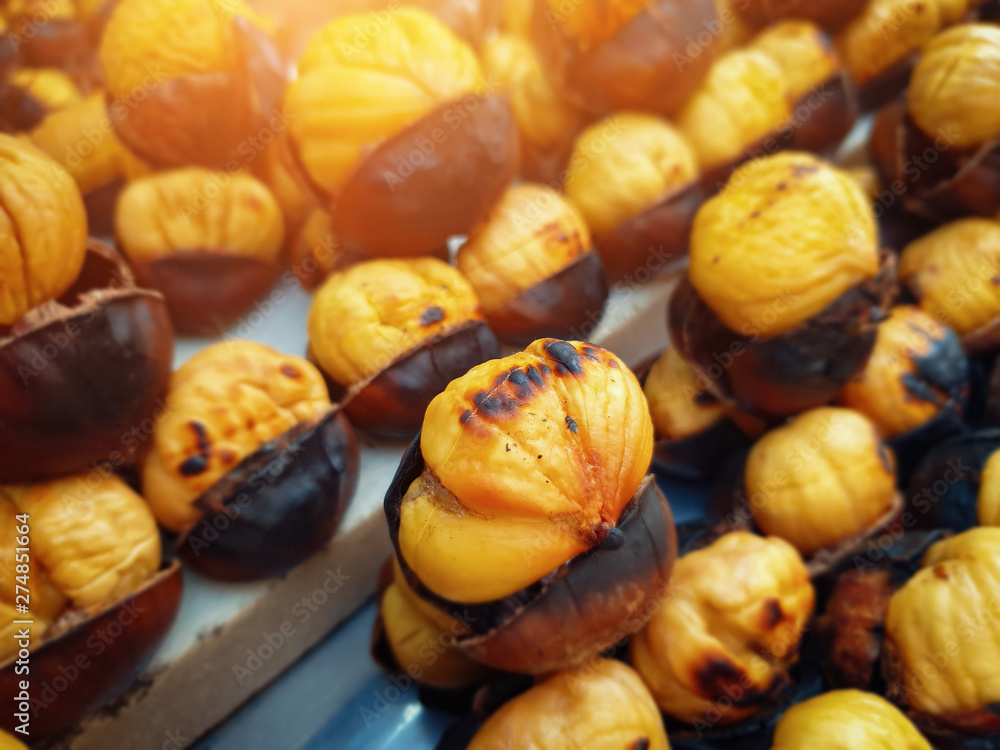 roasted sweet chestnuts on counter on street roasted sweet chestnuts on counter on street