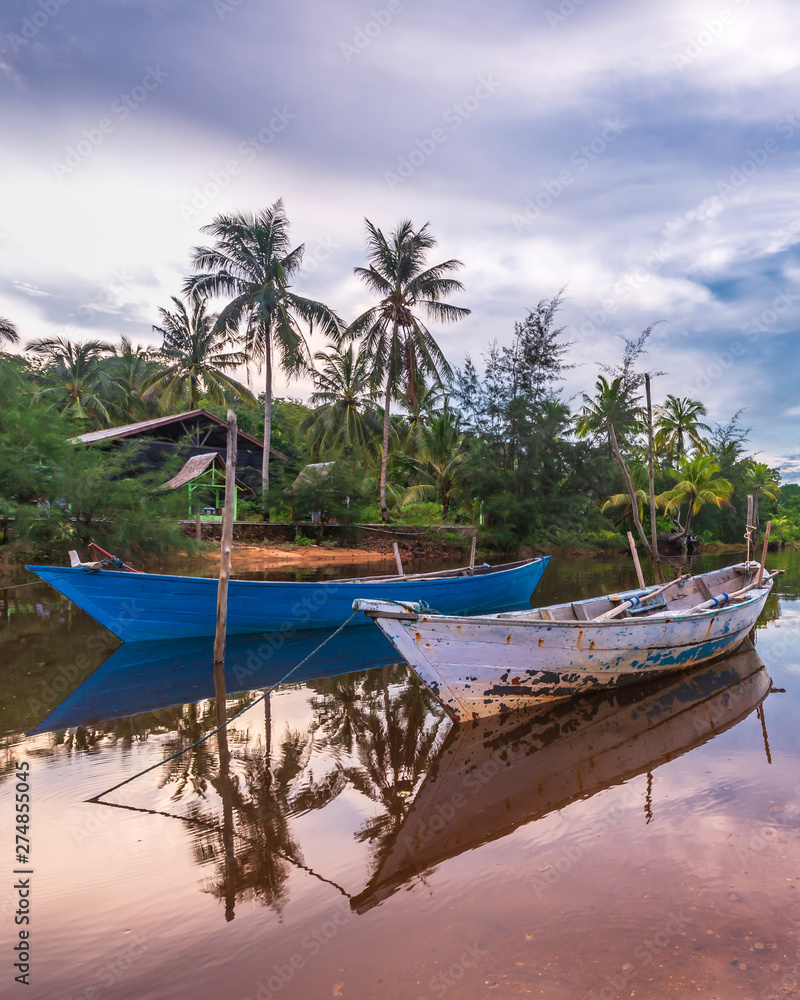 Fototapeta premium The Couple Traditional boat at bintan island Indonesia