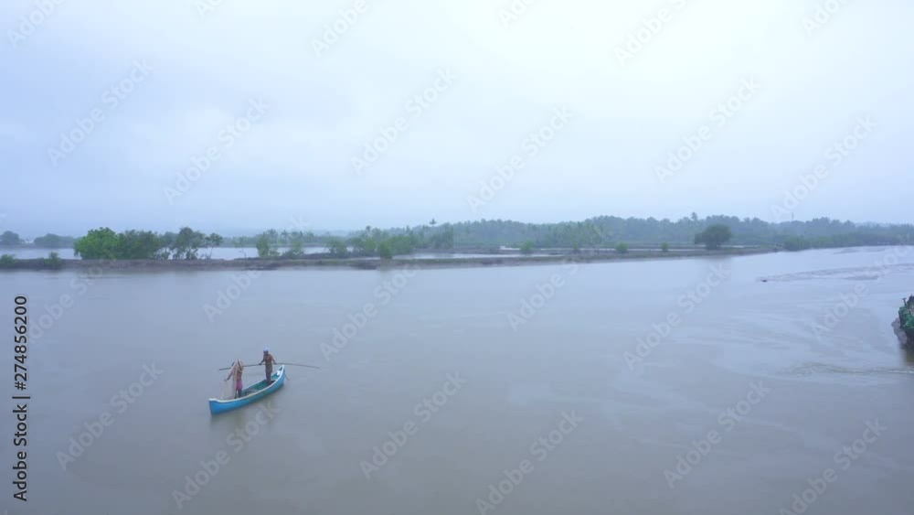 Fishermen on wooden boat fishing in big river in early morning. Fishermen on wooden boat fishing in big river in early morning.