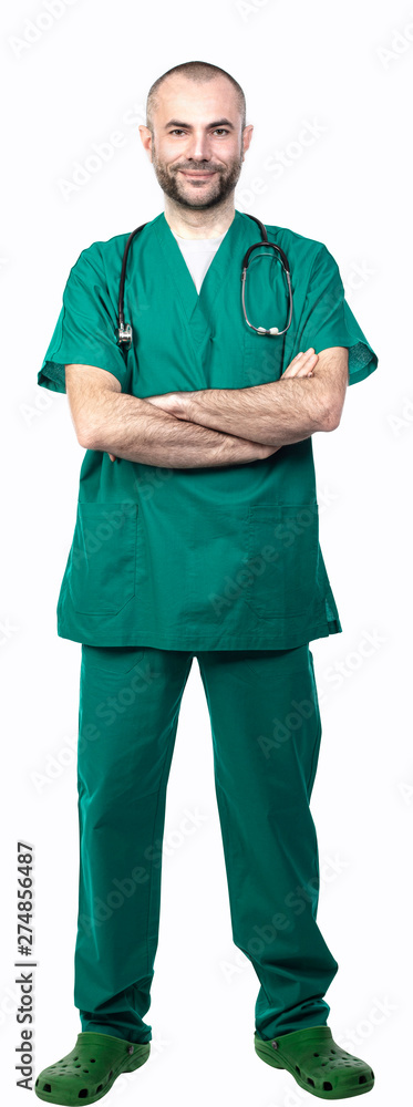standing doctor with green uniform, crossed arms side view standing doctor with green uniform, crossed arms side view