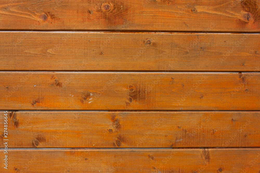 Fototapeta premium background of brown-orange boards, selective focus