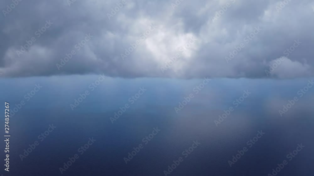 Aerial view of sea, clouds and land from a helicopter cabin flying over sea. Aerial view of sea, clouds and land from a helicopter cabin flying over sea.