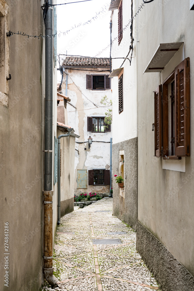 narrow street in Moscenicka Draga, Croatia