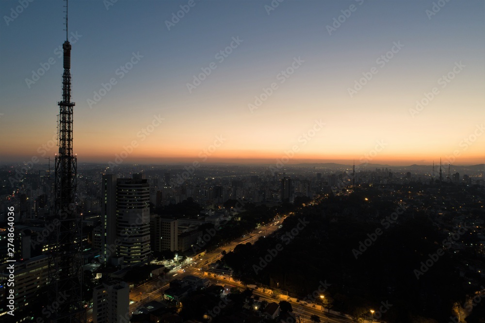 Fototapeta premium Sunset aerial view in São Paulo, Brazil. Great landscape. Explosion of colors on skyline. Business travel. Travel destination.