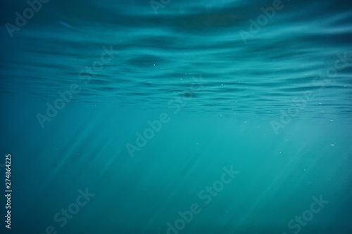 ocean water blue background underwater rays sun   abstract blue background nature water