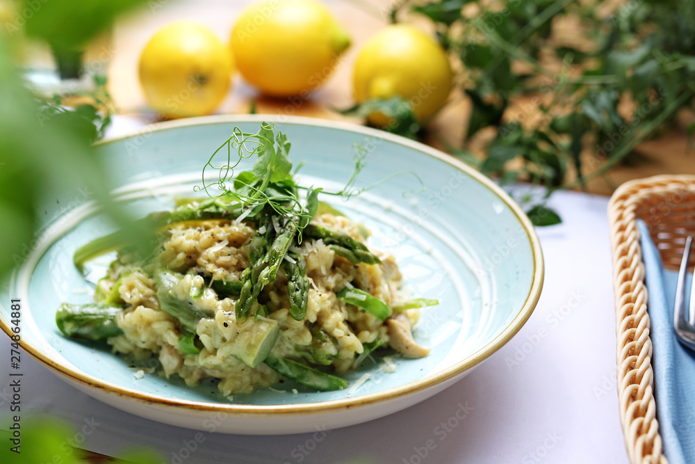 Risotto with spinach and green asparagus. Appetizing dish Risotto with spinach and green asparagus. Appetizing dish