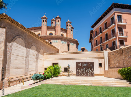 Teruel,Aragón,Spain. Garden and exterior facade of the church of San Pedro, in the Mudejar style