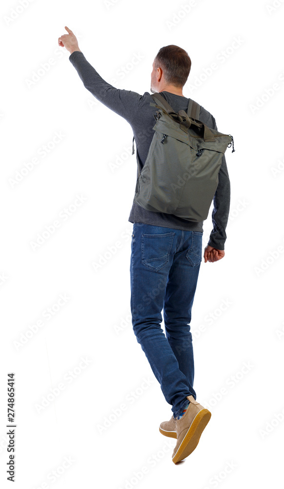 Back view of a walking man with a bag pointing his hand up. Back view of a walking man with a bag pointing his hand up.