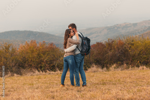 Young couple enjoying hiking together through the countryside. © Zoran Zeremski