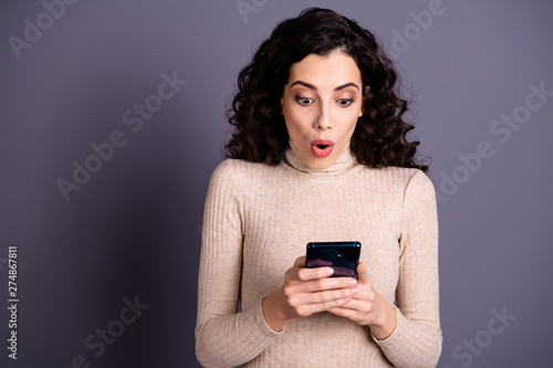 Close up photo amazing attractive she her lady hold hands arms telephone reader instagram post followers news novelty unexpected wear casual beige pastel sweater pullover isolated grey background