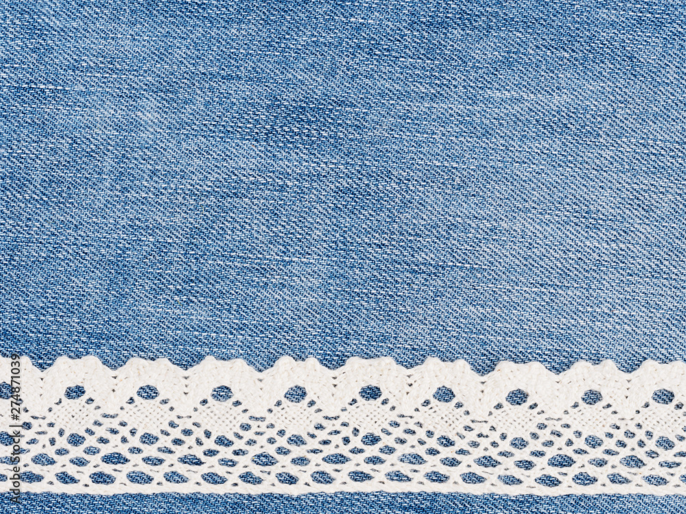 Beige lace on a jeans background. Sewing still life Beige lace on a jeans background. Sewing still life