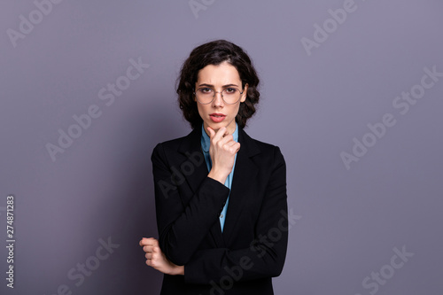 Portrait of charming confident gorgeous entrepreneur touch chin look serious focused wavy culry haircut isolated trendy stylish ponder grey background classy black jacket