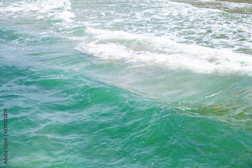 Fototapeta premium small waves on the surface of the blue sea