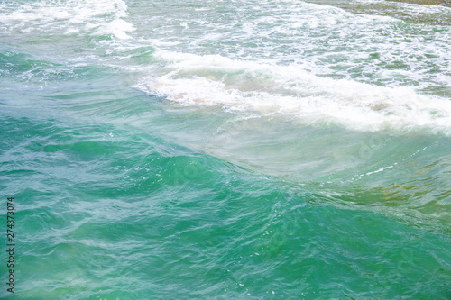 small waves on the surface of the blue sea