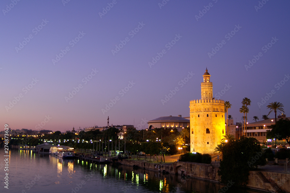 Seville (Spain). Night view of the Torre del Oro in the city of Seville