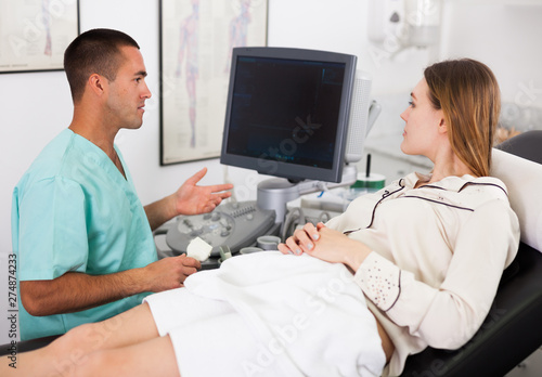 Sonographer talking with patient before procedure photo