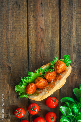 meatballs sandwich (snack with meat and vegetables). food background. top view. copy space