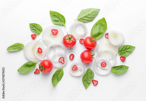 Fresh vegetables and basil on white background