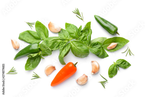 Fresh vegetables and spices on white background