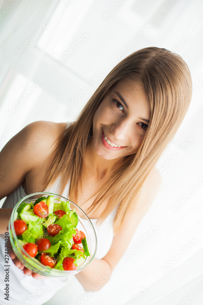 Diet and Healthy eating. Young woman eating healthy salad after workout Diet and Healthy eating. Young woman eating healthy salad after workout