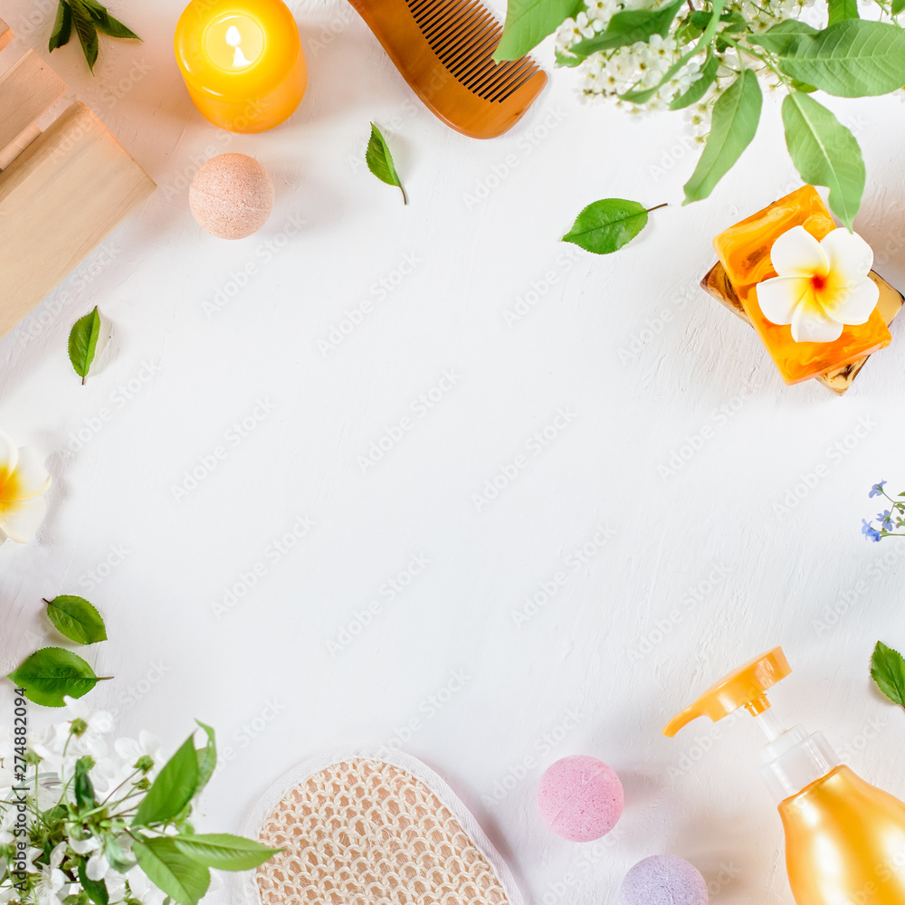 Spa and bath accessories with bath salts and beauty treatment products on white table. Wellness concept Spa and bath accessories with bath salts and beauty treatment products on white table. Wellness concept