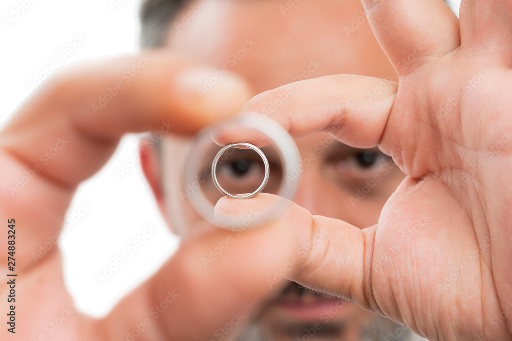 Fototapeta premium Closeup of man holding rings