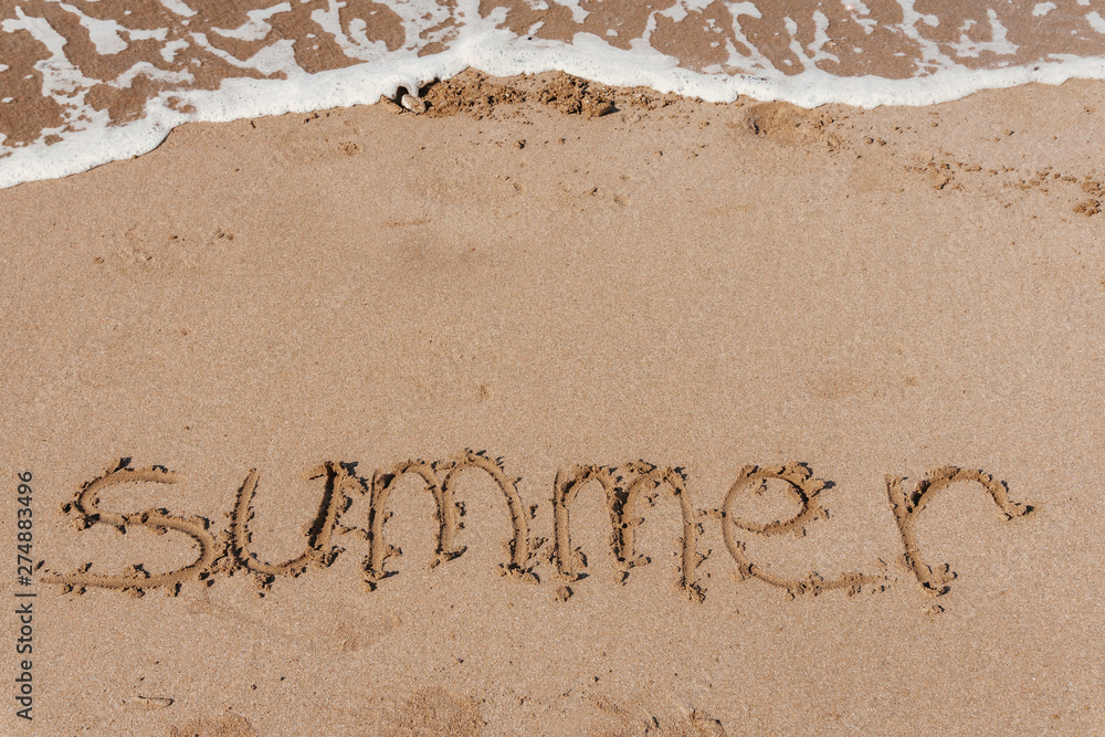 Fototapeta premium Summer (inscription) on the beach (sand) by the sea or ocean. Summer mood concept.