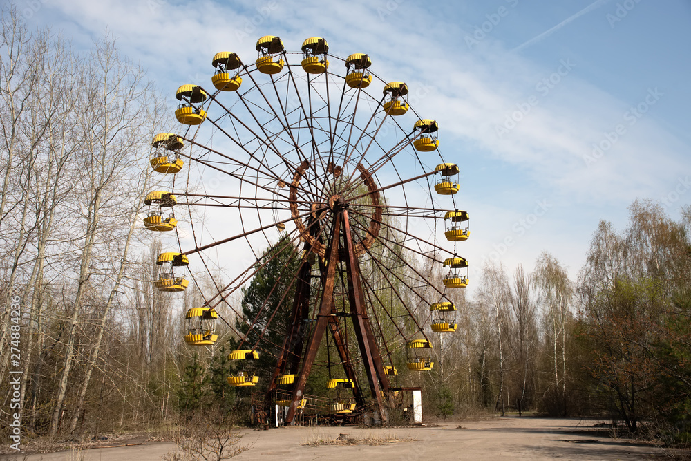 Old ferris wheel in the ghost town of Pripyat. Consequences of the accident at the Chernobyl nuclear power plant