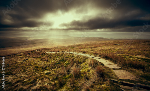 A stone path leading to the summit of Ingleborough, part of the Three Peaks in the Yorkshire Dales. photo