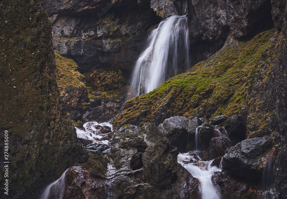 Gordale Scar Waterfall Through Limeston Cliffs Near Malham Cove In The gordale-scar-waterfall-through-limeston-cliffs-near-malham-cove-in-the