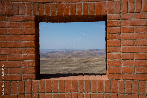 Agricultural landscape of Murgia plateau viewed from a window. Poggiorsini village. Apulia region, Italy photo