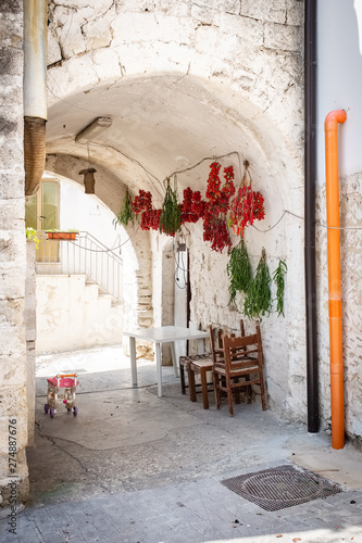Typical old town house with peppers and tomato hung out to dry. Spinazzola, Apulia region, Italy