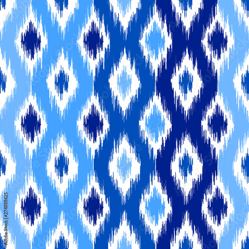 Uzbek ikat silk fabric pattern, indigo blue and white colors.