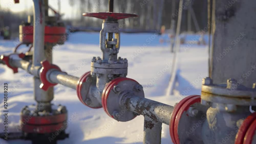 Close-up of a industrial gas pipe in field in winter. Close-up of a industrial gas pipe in field in winter.