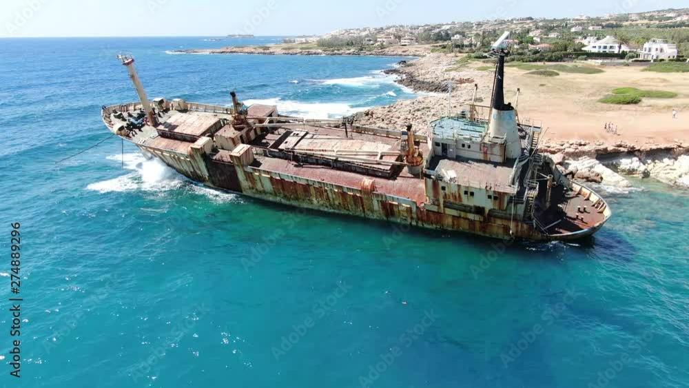 Video from above. Aerial view of sea coast. Flying over coastline with broken ship. Mediterranean Sea and the coast. Shooting from the drone. Cyprus. Video from above. Aerial view of sea coast. Flying over coastline with broken ship. Mediterranean Sea and the coast. Shooting from the drone. Cyprus.
