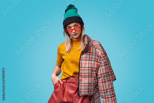 Confident trendy woman looking at camera photo