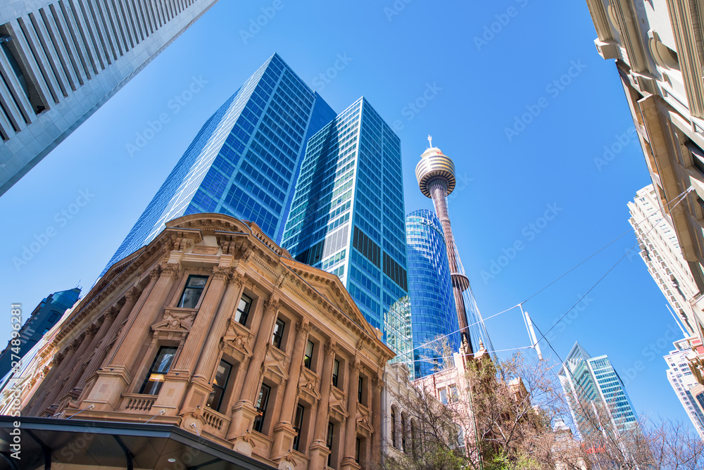 Fototapeta premium SYDNEY - AUGUST 18, 2018: City buildings in Pitt Street, skyward view. Sydney attracts 20 million tourists annually
