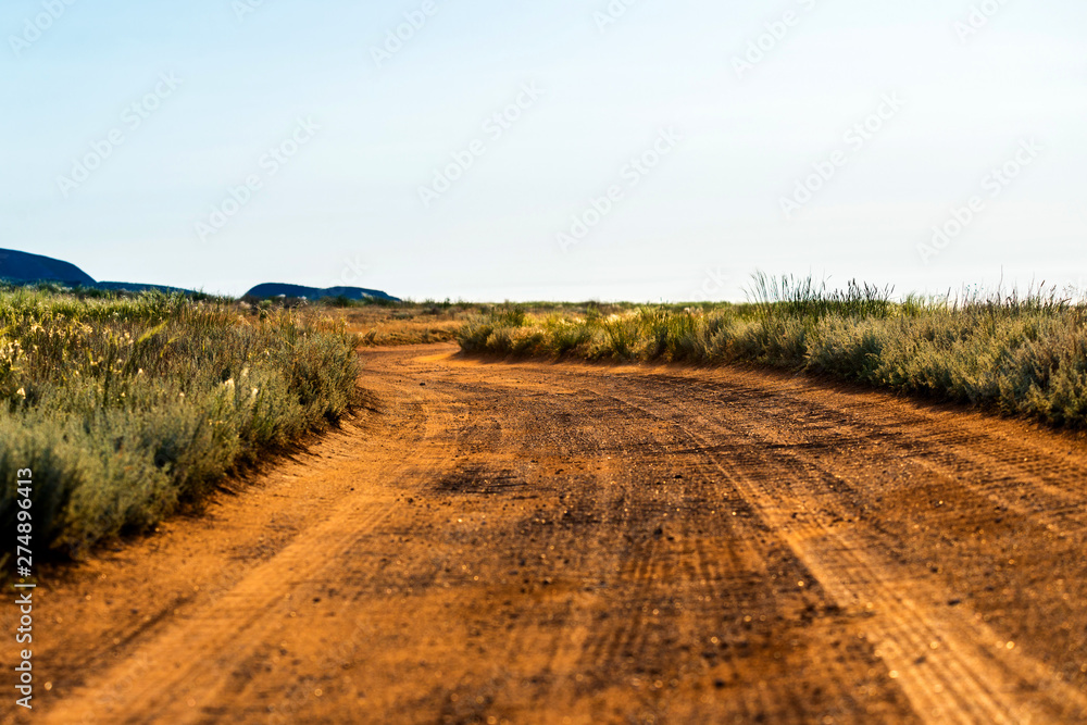 Rural dirt road landscape in steppe or desert. Rural dirt road landscape in steppe or desert.