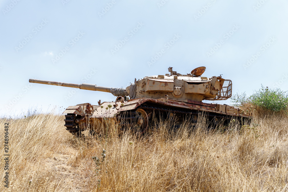 Fototapeta premium Destroyed Israeli tank is after the Doomsday (Yom Kippur War) on the Golan Heights in Israel, near the border with Syria