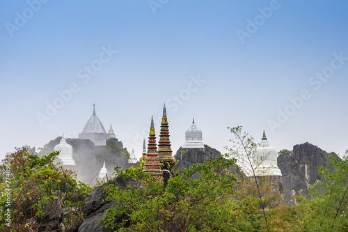 Chaloem Phra Kiat Temple, Pagoda on the mountain in the mist,Thailand