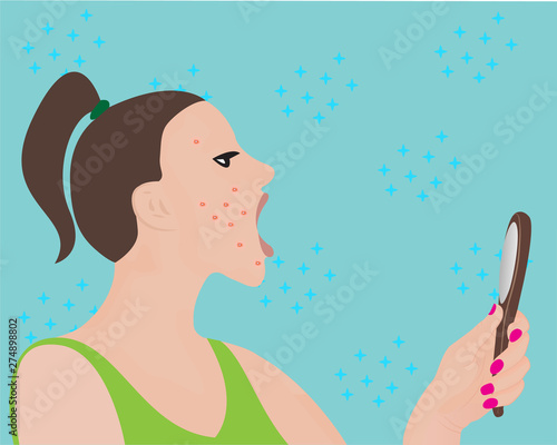 A young woman looking at a mirror 